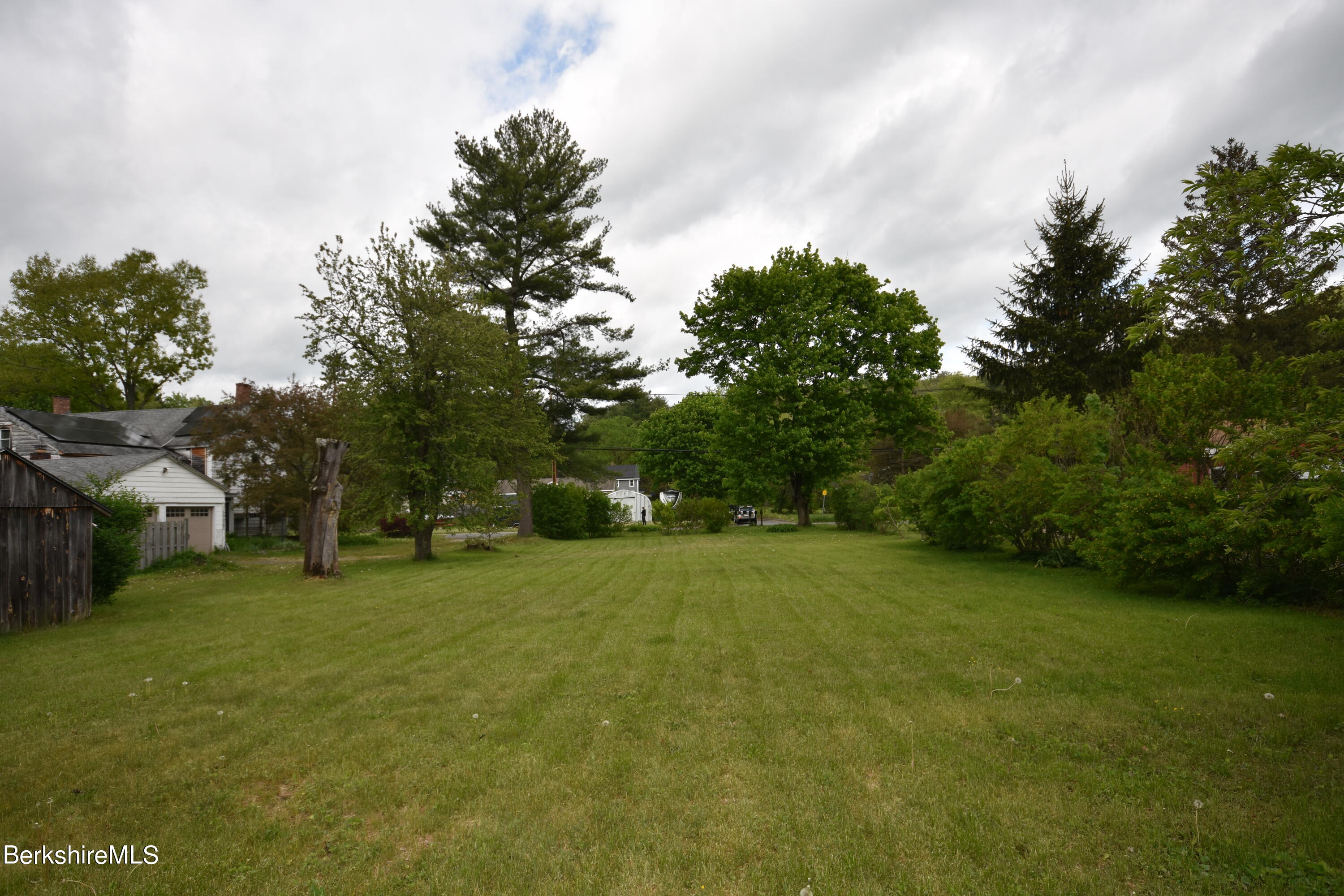 110 Tyringham Road Lee, MA 01238 - Photo 59 of 60 a view of a field with trees in the background