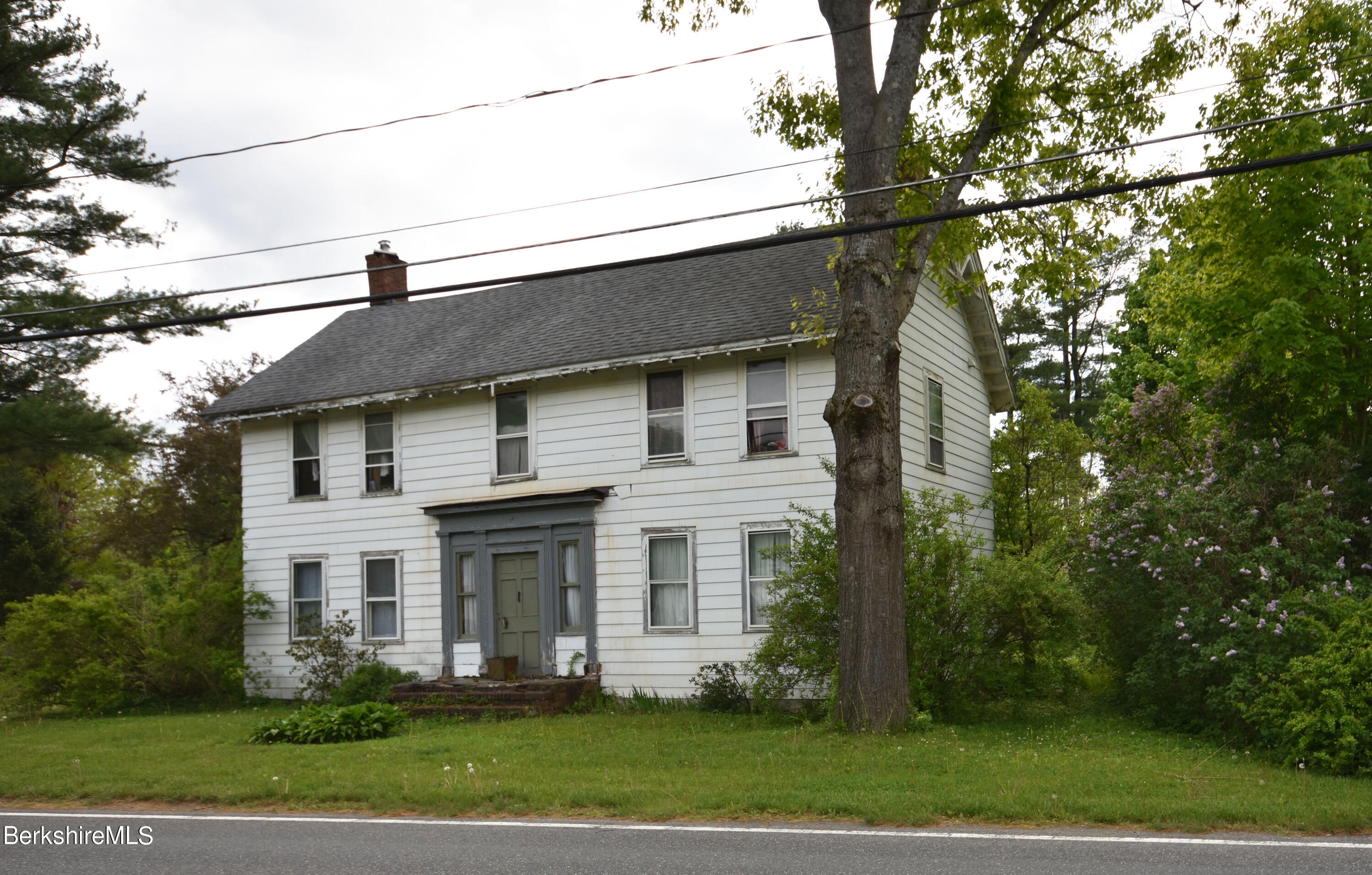 110 Tyringham Road Lee, MA 01238 - Photo 60 of 60 a front view of a house with a garden and trees