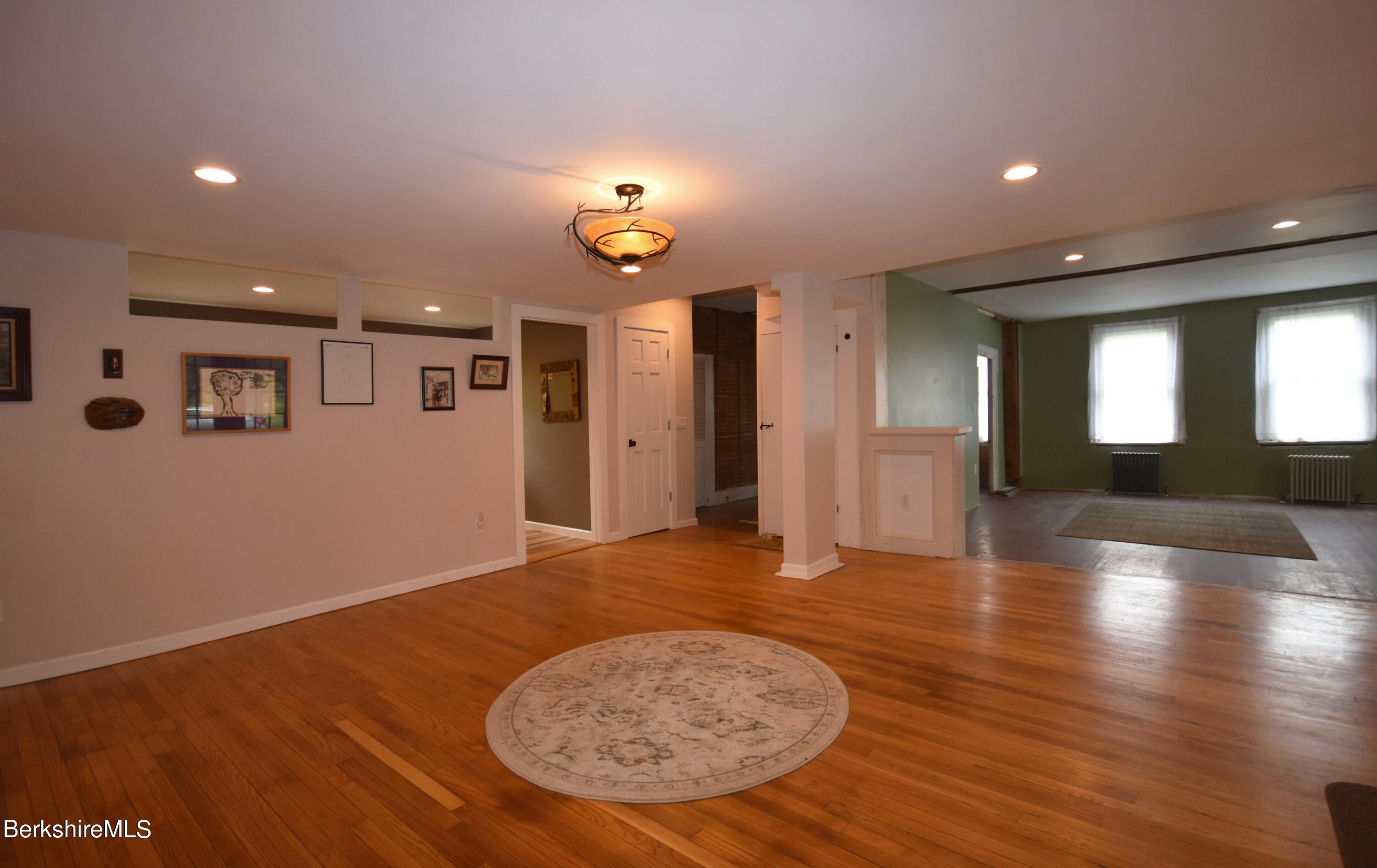 110 Tyringham Road Lee, MA 01238 - Photo 8 of 60 an empty room with wooden floor and windows