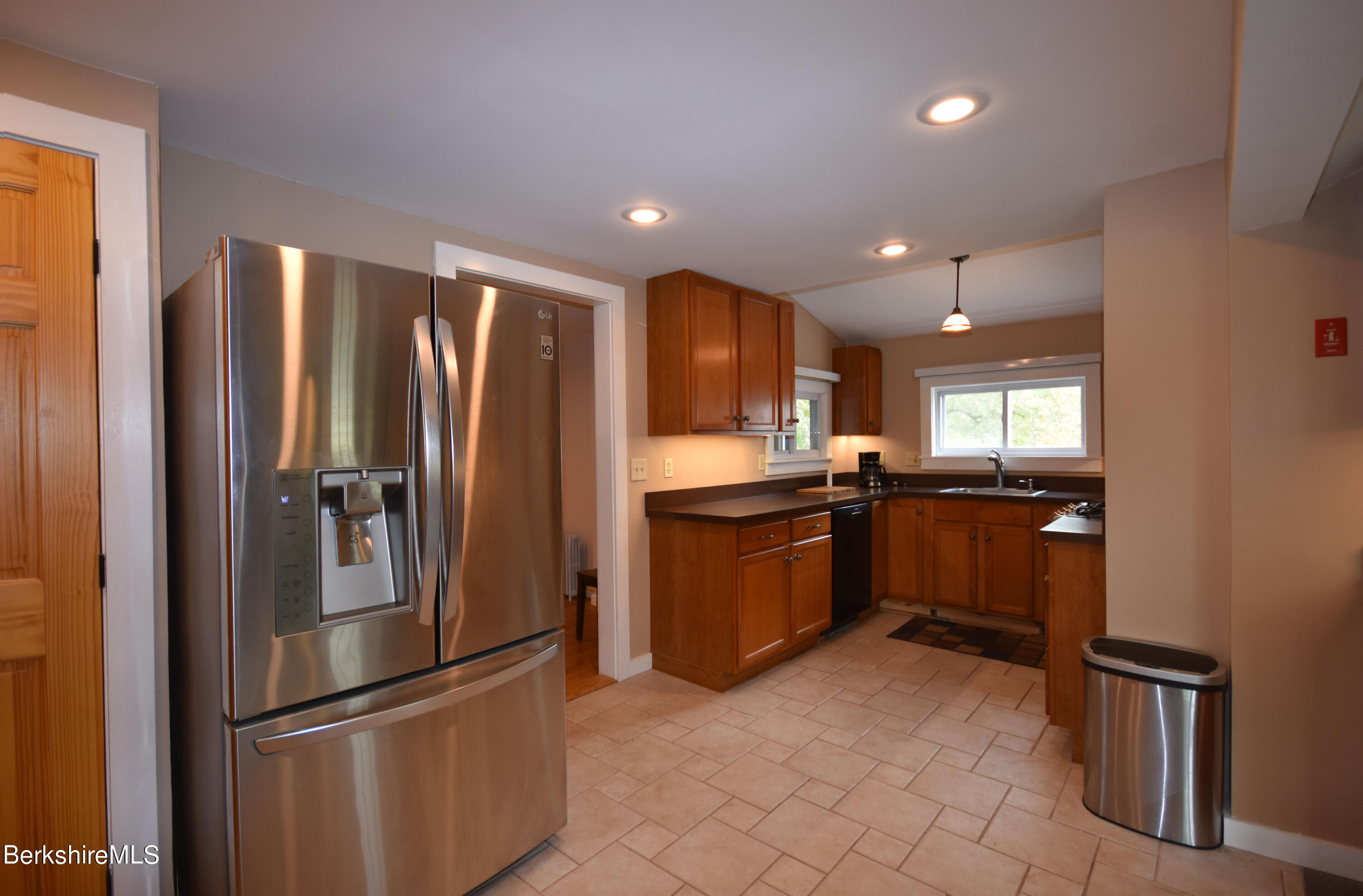 110 Tyringham Road Lee, MA 01238 - Photo 10 of 60 a kitchen with granite countertop a refrigerator and a sink