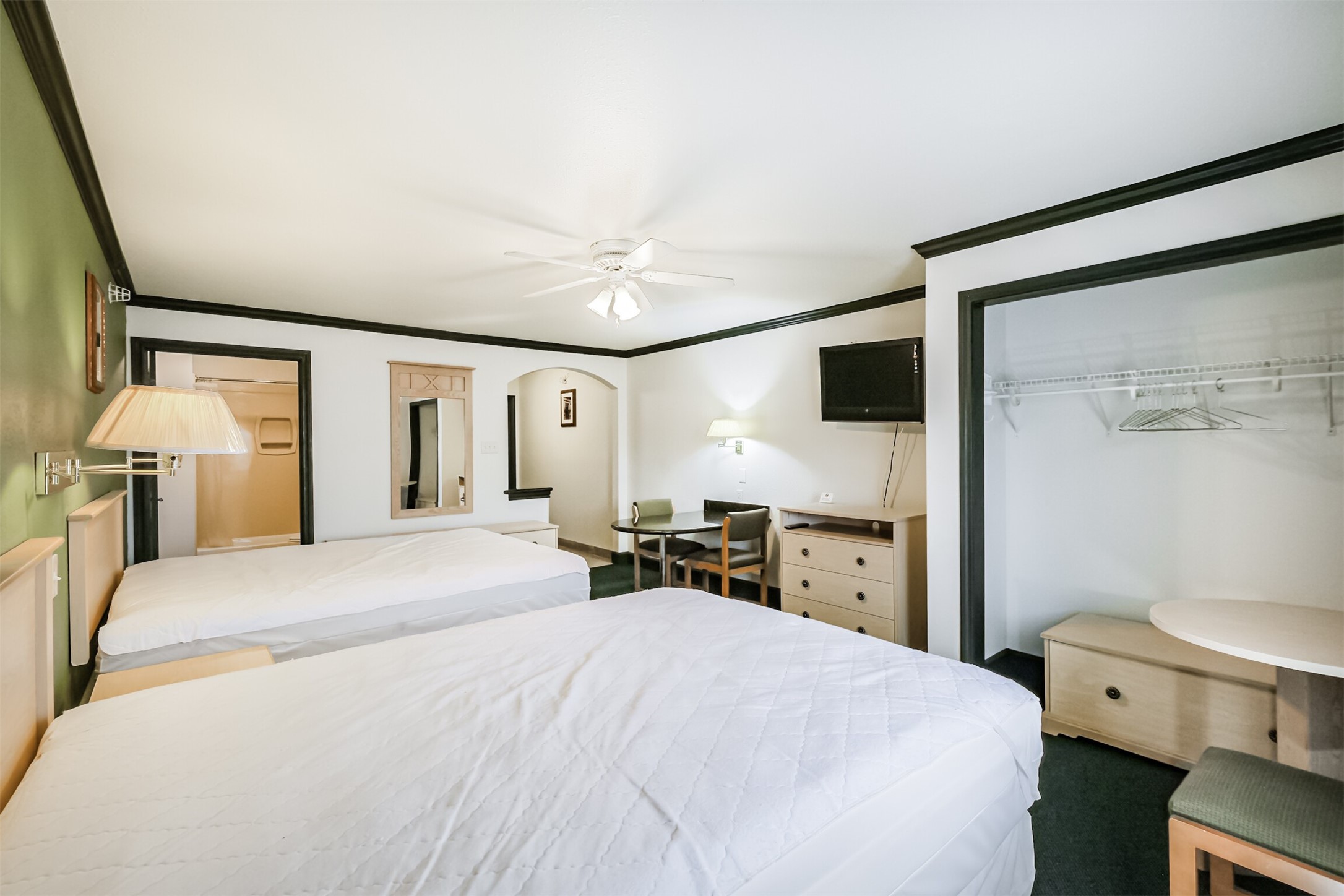 1025 Swanson Street, Unit 210 Houston, TX 77030 - Photo 14 of 19 a bedroom with a bed and a chandelier