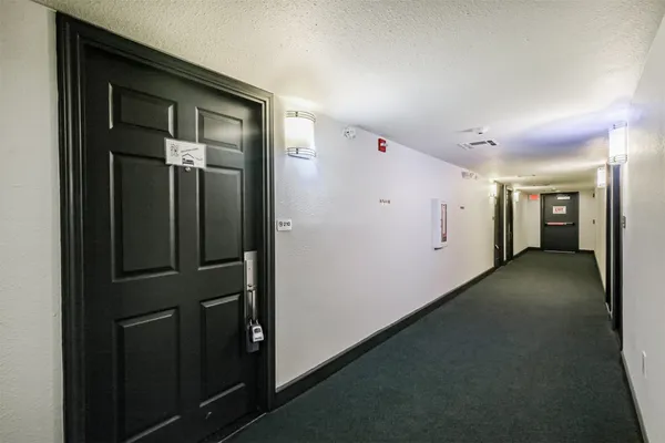 a kitchen with stainless steel appliances granite countertop a refrigerator stove and cabinets