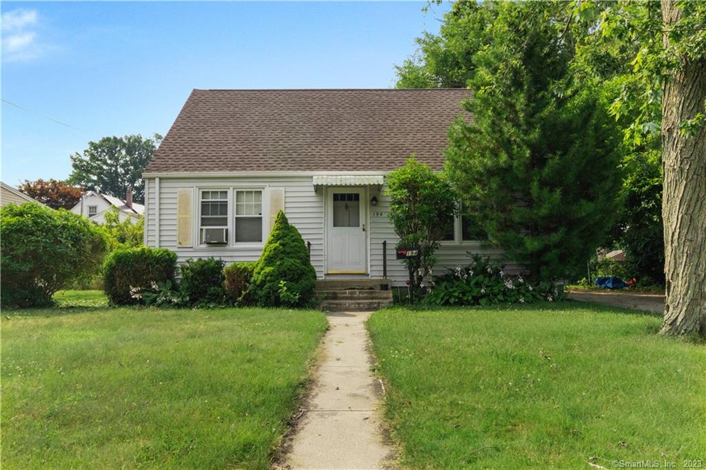 194 Meadows End Road Milford, CT 06460 - Photo 1 of 1 a front view of house with yard and green space