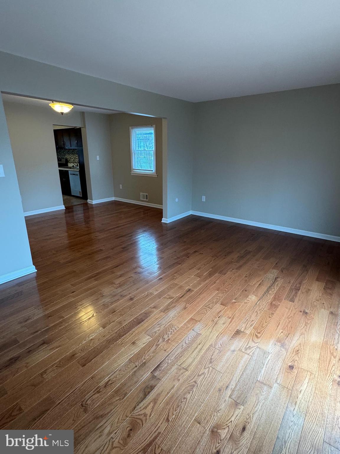 116 Reeger Avenue Hamilton, NJ 08610 - Photo 11 of 25 a view of empty room with wooden floor