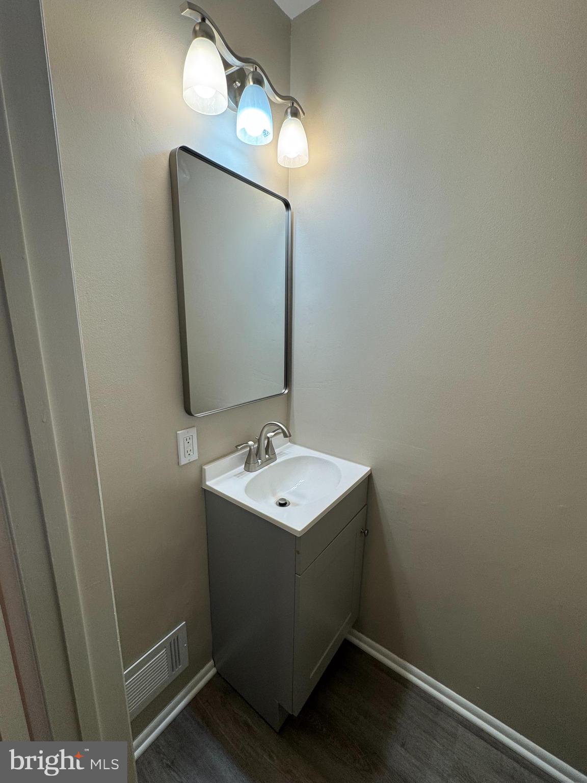 116 Reeger Avenue Hamilton, NJ 08610 - Photo 13 of 25 a bathroom with a sink toilet and mirror