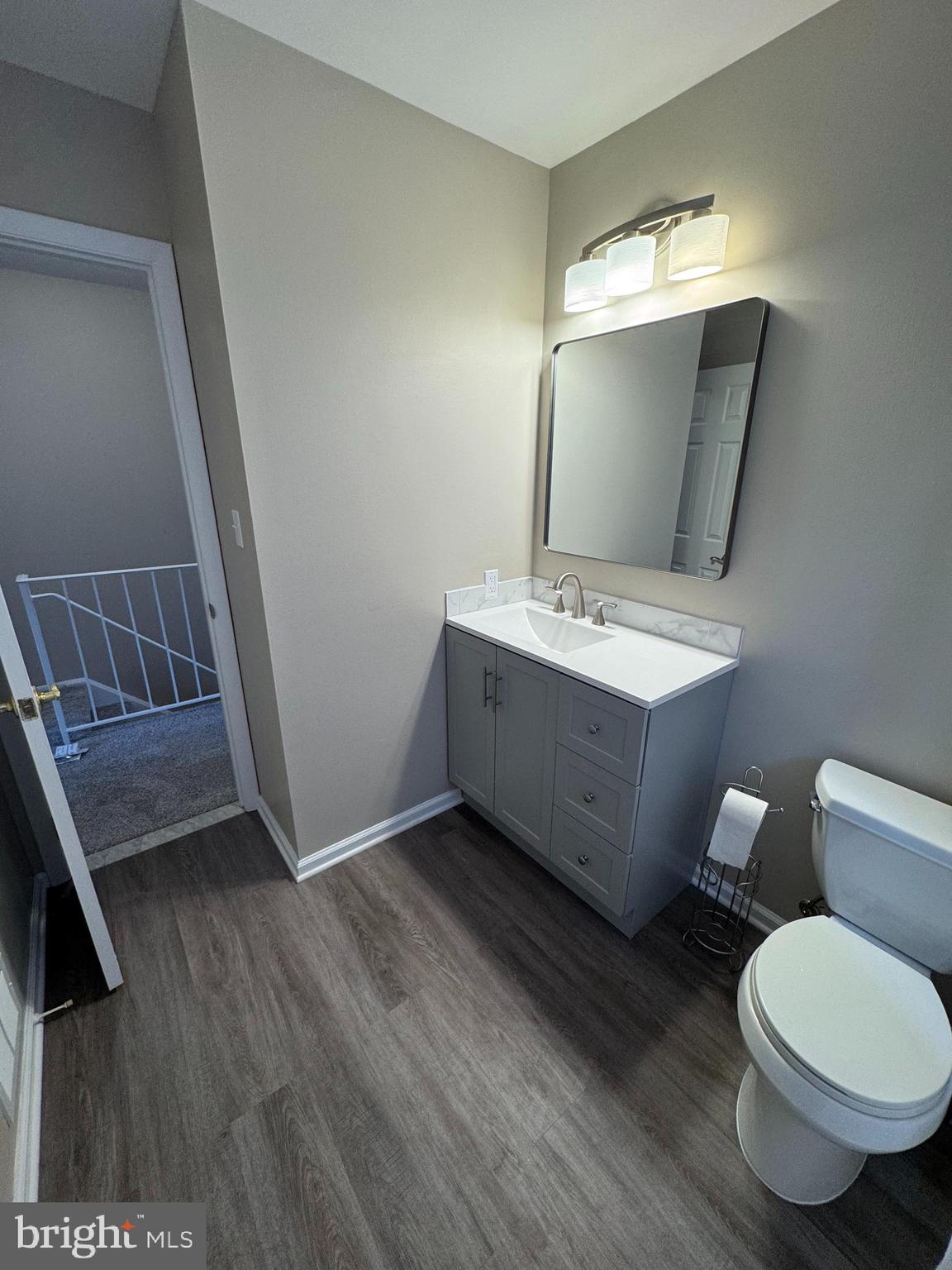 116 Reeger Avenue Hamilton, NJ 08610 - Photo 20 of 25 a bathroom with a toilet sink and mirror