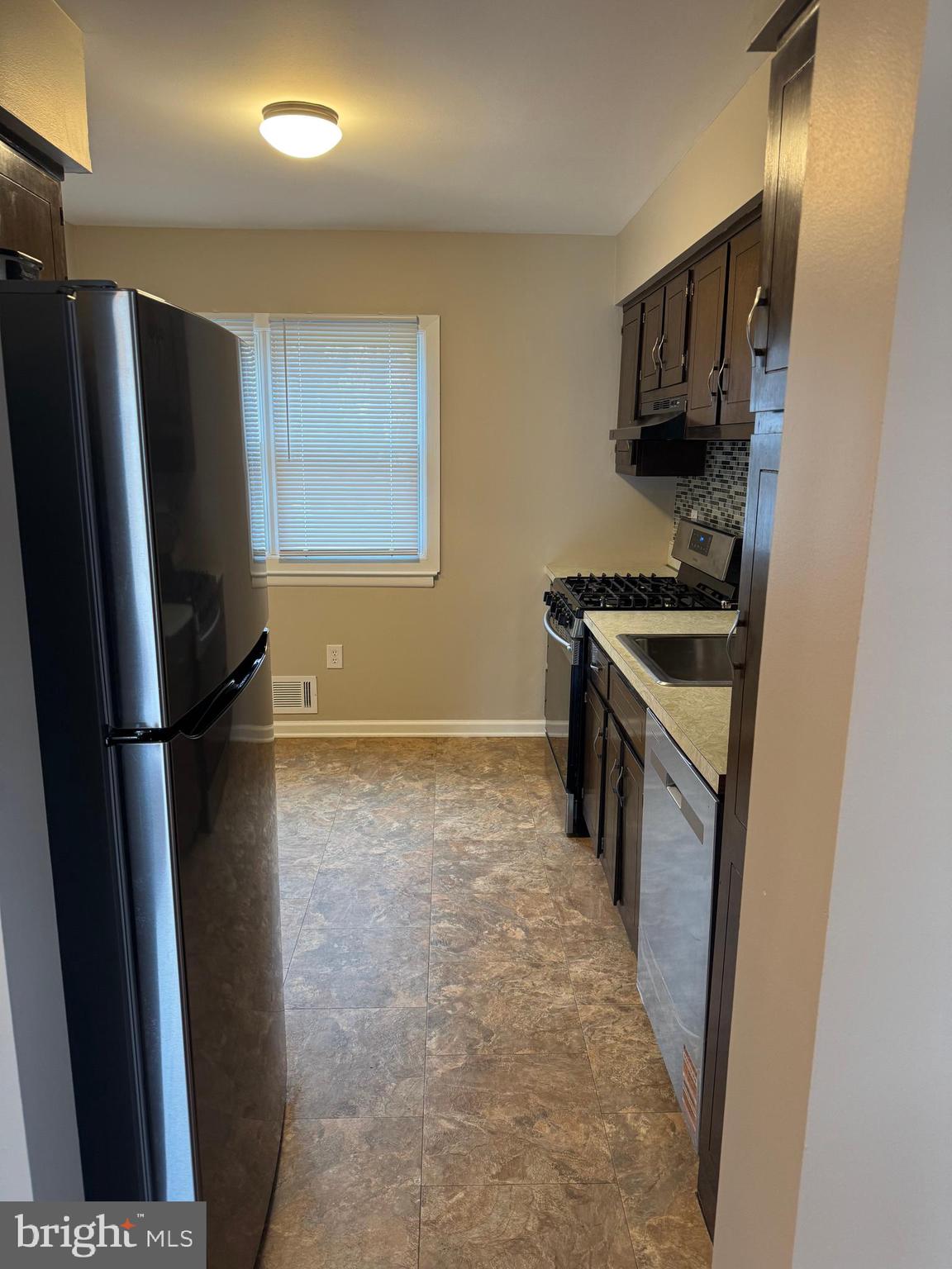 116 Reeger Avenue Hamilton, NJ 08610 - Photo 8 of 25 a kitchen with a refrigerator stove and sink