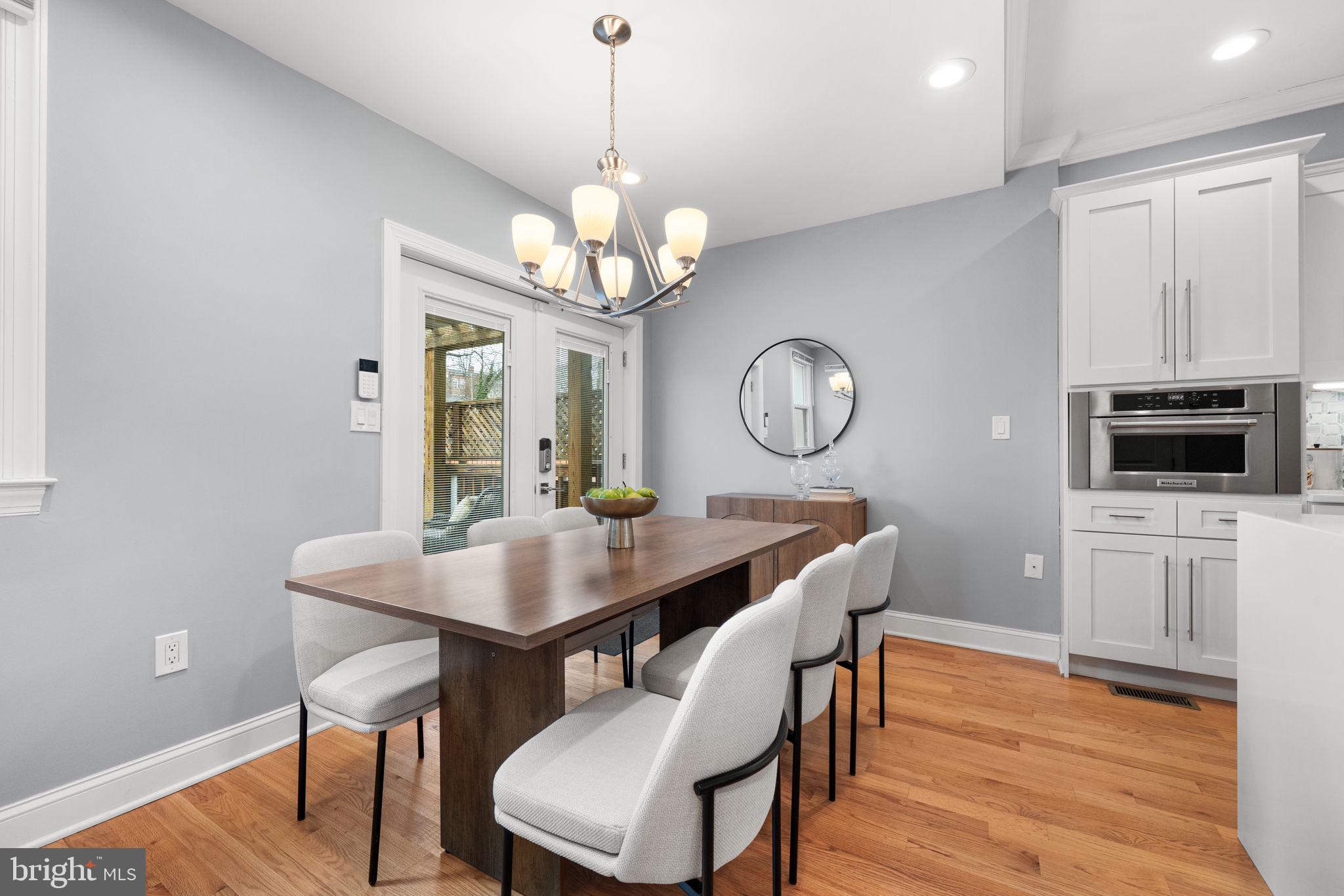 5302 7th Street Northwest Washington, DC 20011 - Photo 14 of 45 a view of a dining room with furniture a chandelier and wooden floor