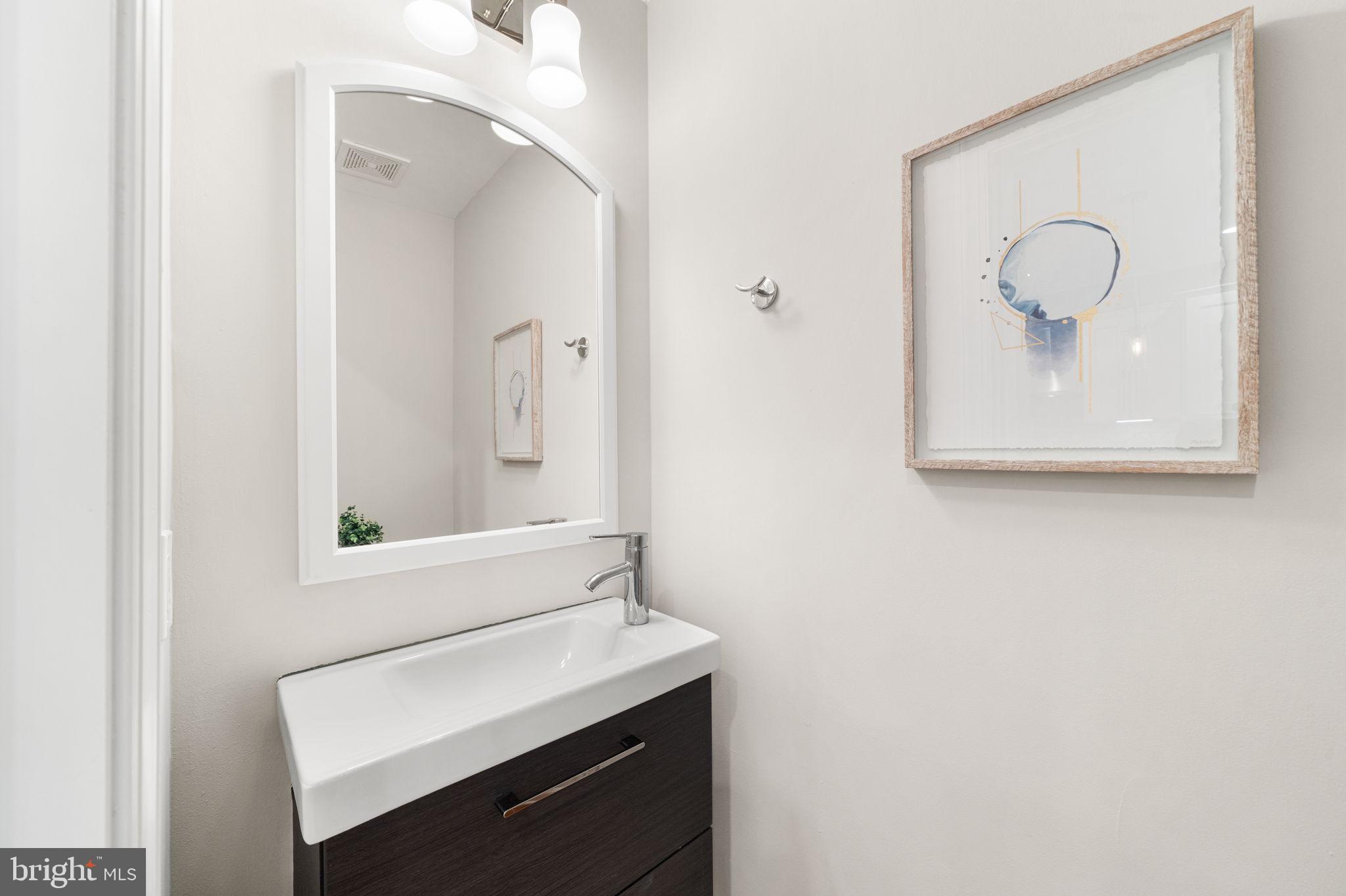 5302 7th Street Northwest Washington, DC 20011 - Photo 16 of 45 a bathroom with a sink and a mirror