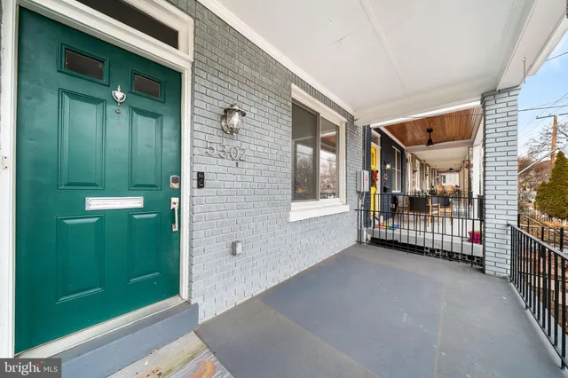 a view of a brick house with an outdoor space