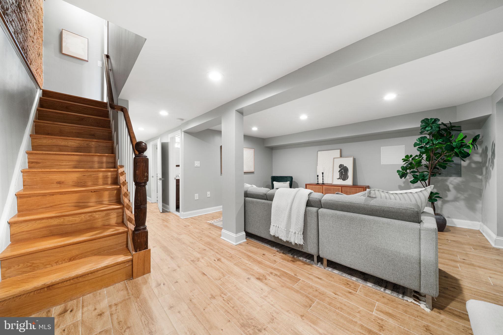 5302 7th Street Northwest Washington, DC 20011 - Photo 29 of 45 a living room with furniture and a wooden floor