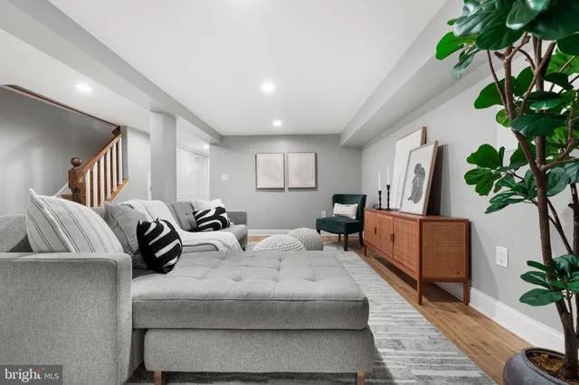 a bedroom with bed and a couch