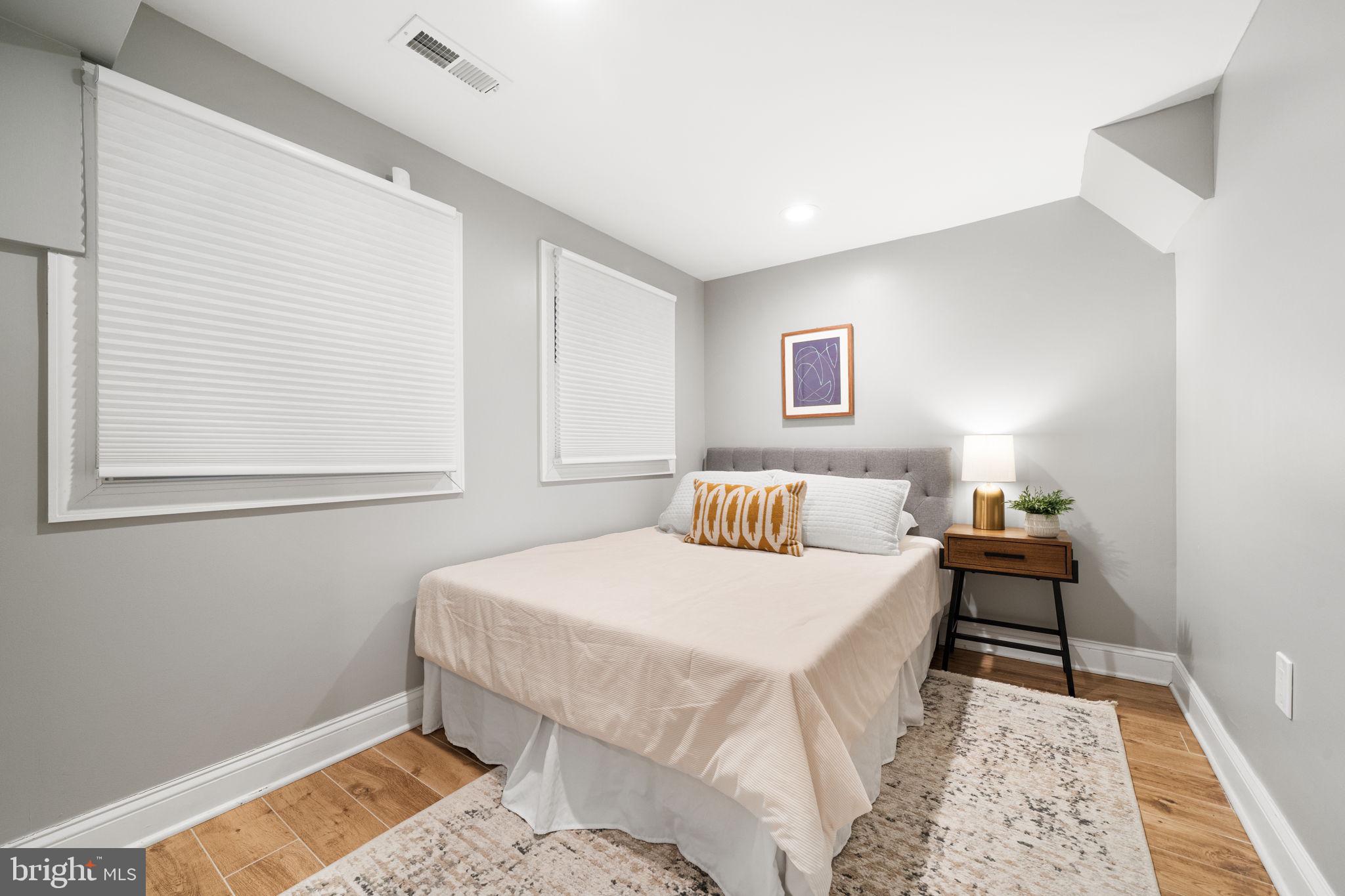 5302 7th Street Northwest Washington, DC 20011 - Photo 32 of 45 a bedroom with a bed and a window