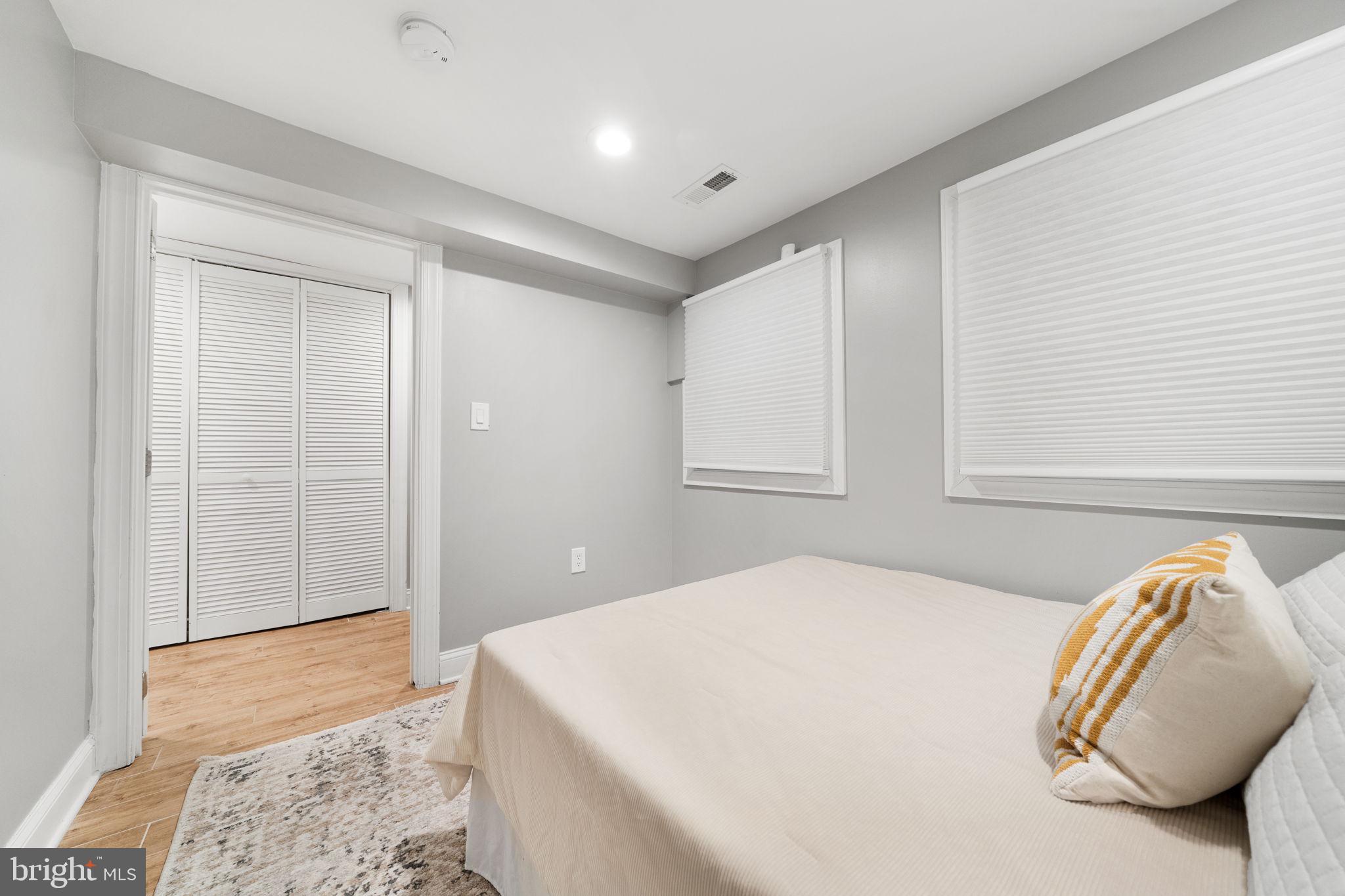 5302 7th Street Northwest Washington, DC 20011 - Photo 33 of 45 a bedroom with a bed and a dresser