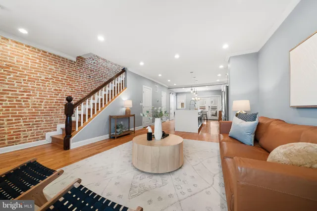 a living room with furniture and a rug