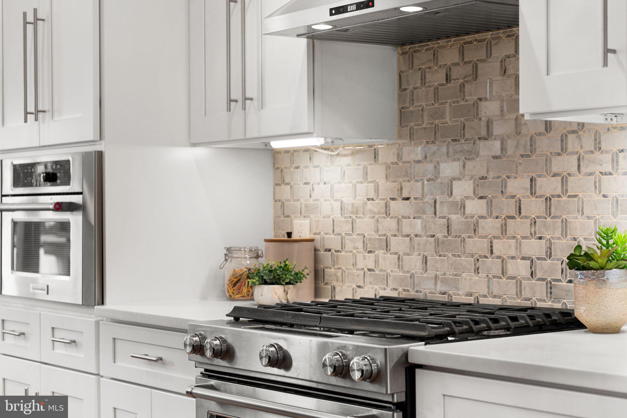 5302 7th Street Northwest Washington, DC 20011 - Photo 10 of 45 a stove top oven sitting inside of a kitchen