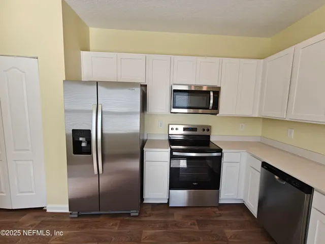 a bathroom with a toilet and a bathtub