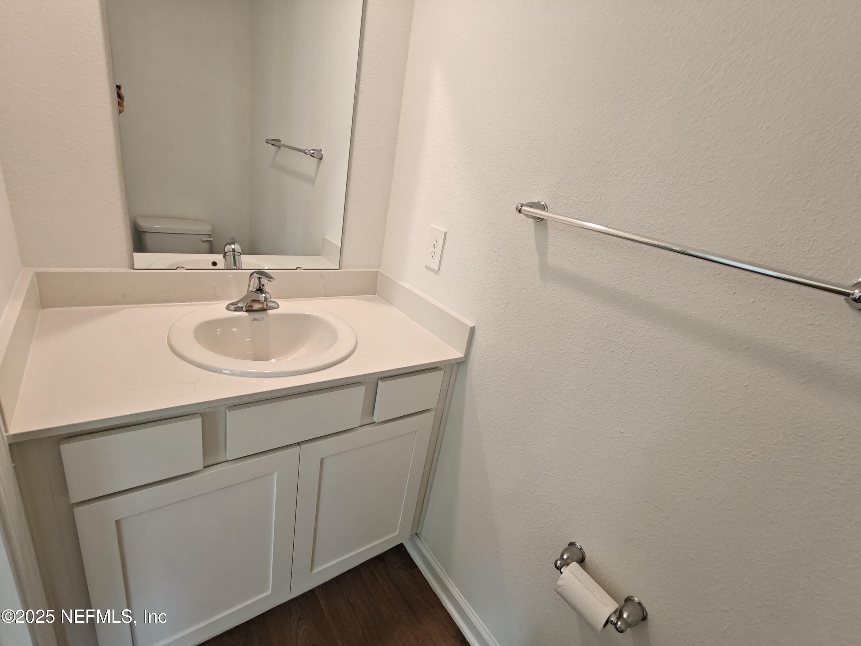 1731 Bridger Trace Middleburg, FL 32068 - Photo 17 of 43 a bathroom with a sink and a mirror