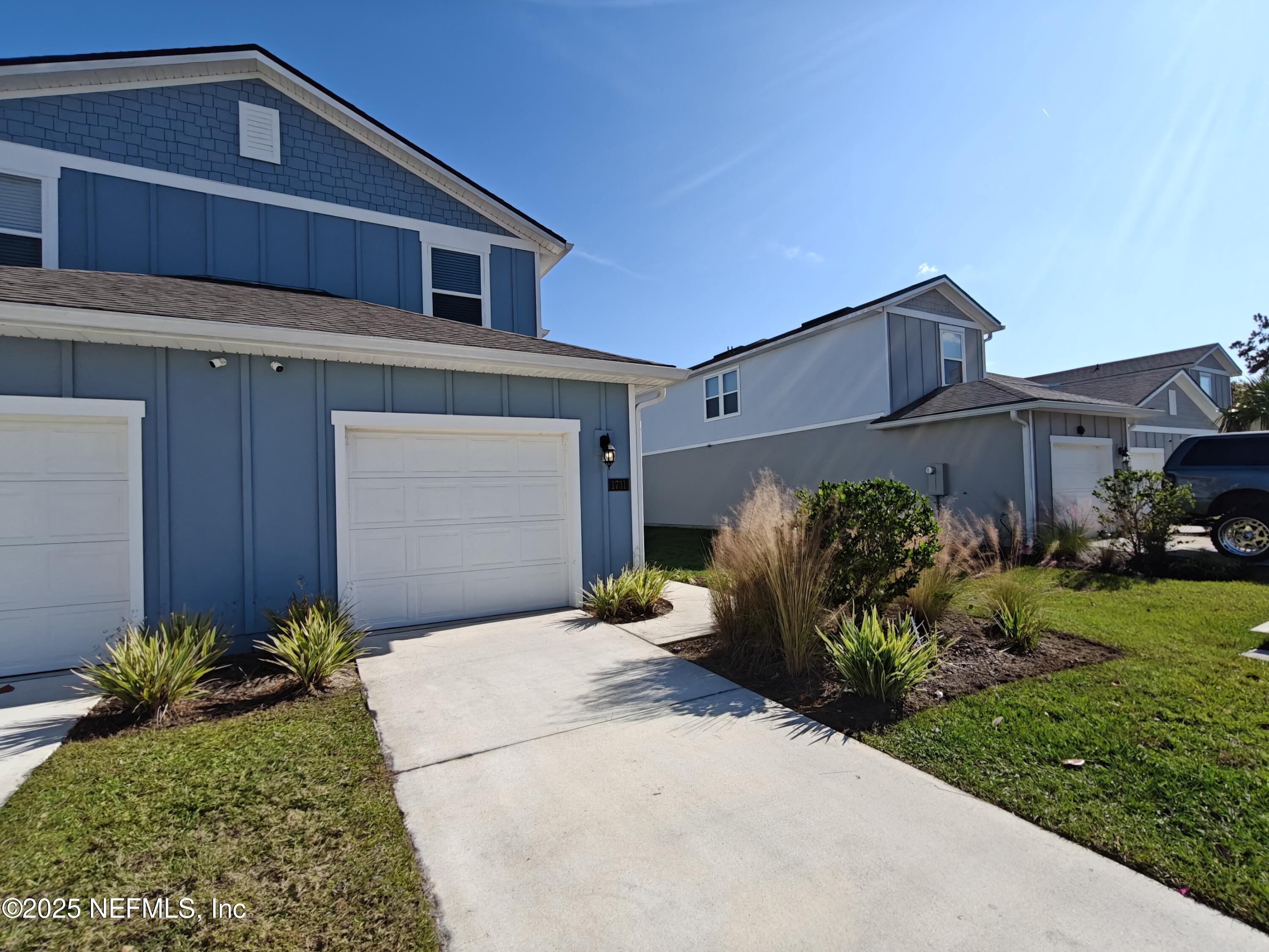 1731 Bridger Trace Middleburg, FL 32068 - Photo 4 of 43 a front view of a house with garden