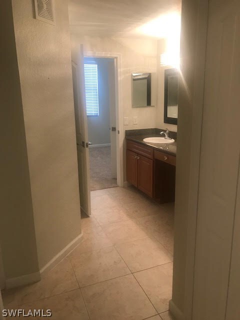 13010 Positano Circle, Unit 101 Naples, FL 34105 - Photo 12 of 26 a view of a bathroom