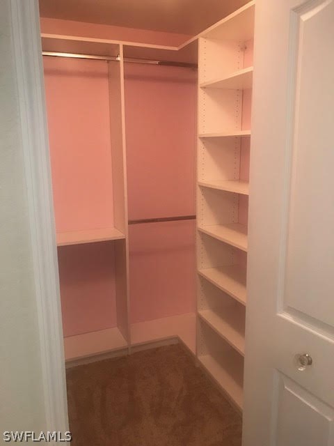 13010 Positano Circle, Unit 101 Naples, FL 34105 - Photo 13 of 26 a view of an empty walk in closet
