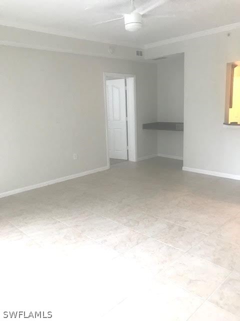 13010 Positano Circle, Unit 101 Naples, FL 34105 - Photo 14 of 26 a view of an empty room with a window