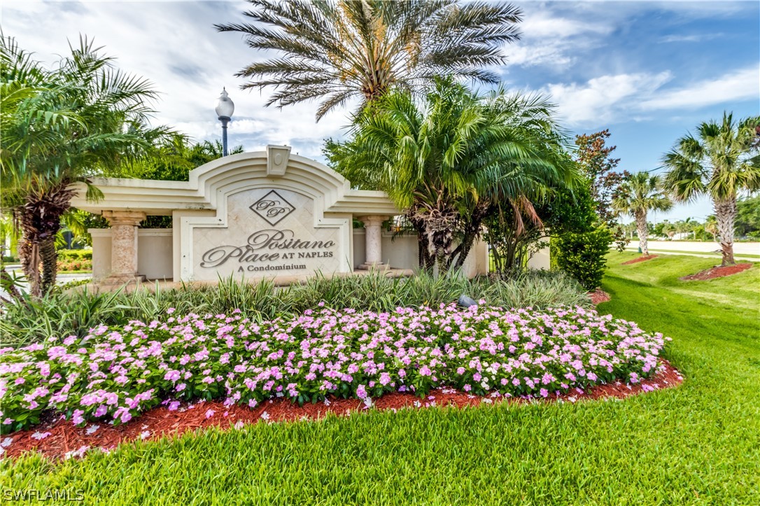 13010 Positano Circle, Unit 101 Naples, FL 34105 - Photo 20 of 26 a front view of a house with a garden