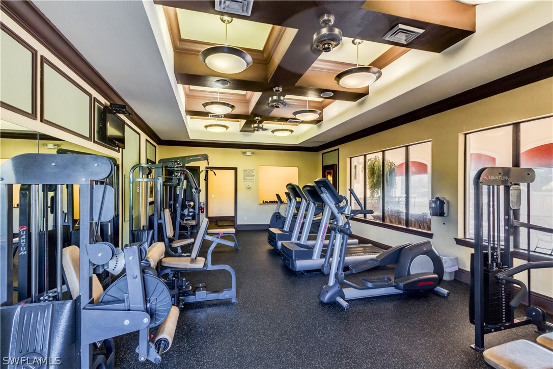 13010 Positano Circle, Unit 101 Naples, FL 34105 - Photo 25 of 26 a view of a room with gym equipment