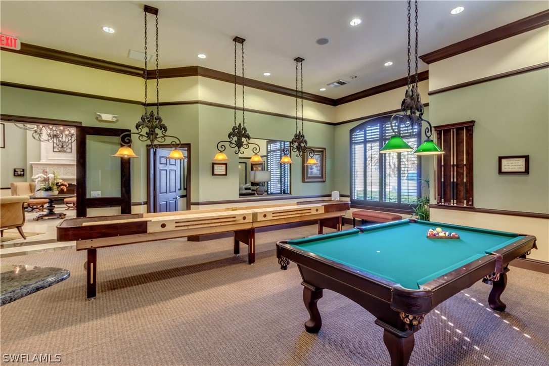 13010 Positano Circle, Unit 101 Naples, FL 34105 - Photo 26 of 26 a room with pool table tables and mirrors
