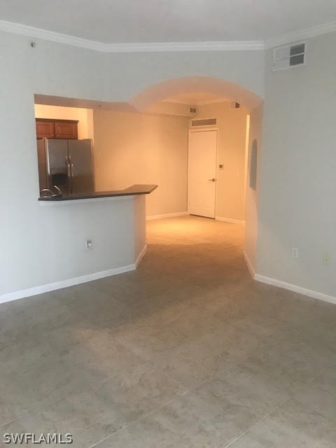 13010 Positano Circle, Unit 101 Naples, FL 34105 - Photo 5 of 26 a view of an empty room