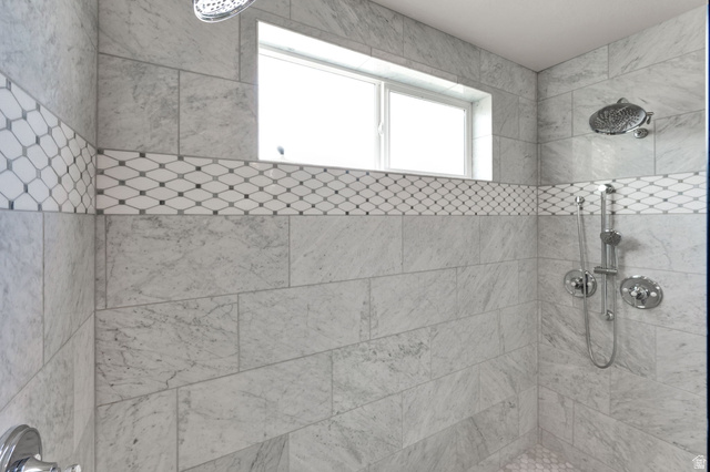 1132 South 1300th Street West Mapleton, UT 84664 - Photo 21 of 52 Spacious primary shower stall featuring large format tile walls with a decorative mosaic band