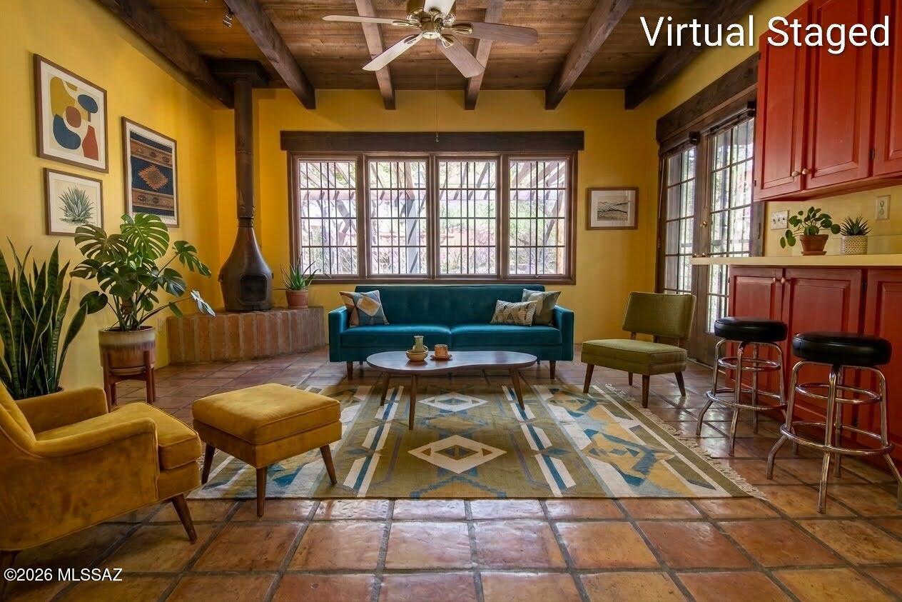 4130 East River Road Tucson, AZ 85718 - Photo 8 of 46 a living room with furniture a rug and a potted plant