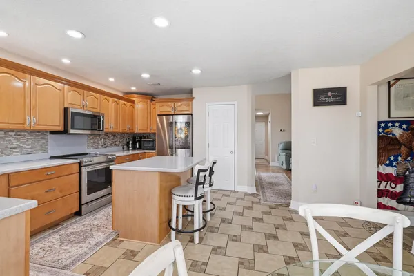 a kitchen with a stove and cabinets