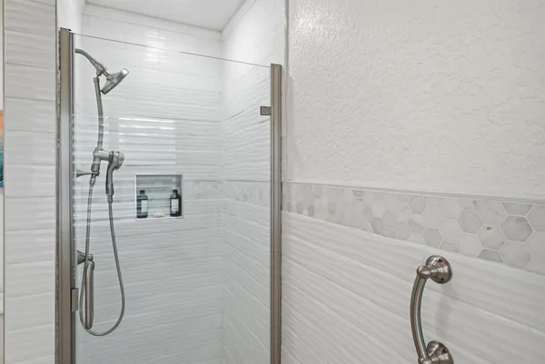 a spacious bathroom with a double vanity sink a and a mirror
