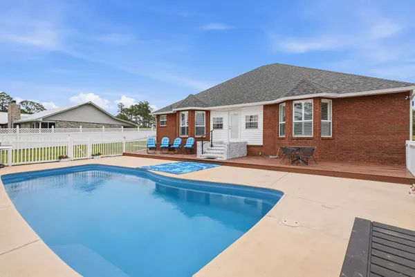 a view of a house with swimming pool