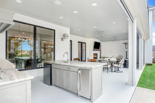 a kitchen with stainless steel appliances granite countertop a sink and a granite counter tops