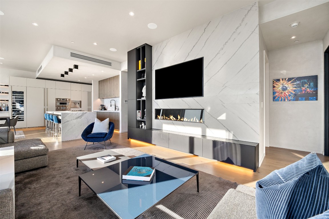 210 Lavaca Street, Unit 2301 Austin, TX 78701 - Photo 11 of 40 a living room with furniture and a flat screen tv