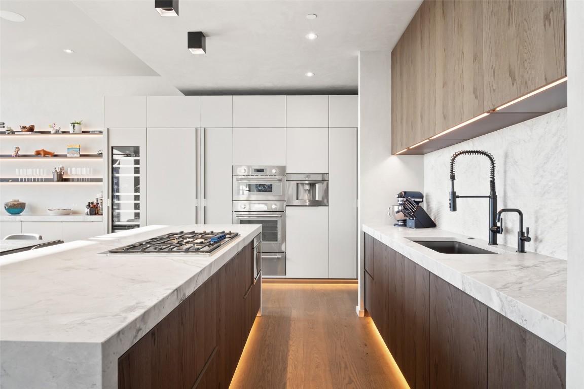 210 Lavaca Street, Unit 2301 Austin, TX 78701 - Photo 16 of 40 a kitchen with kitchen island stainless steel appliances a sink stove and refrigerator
