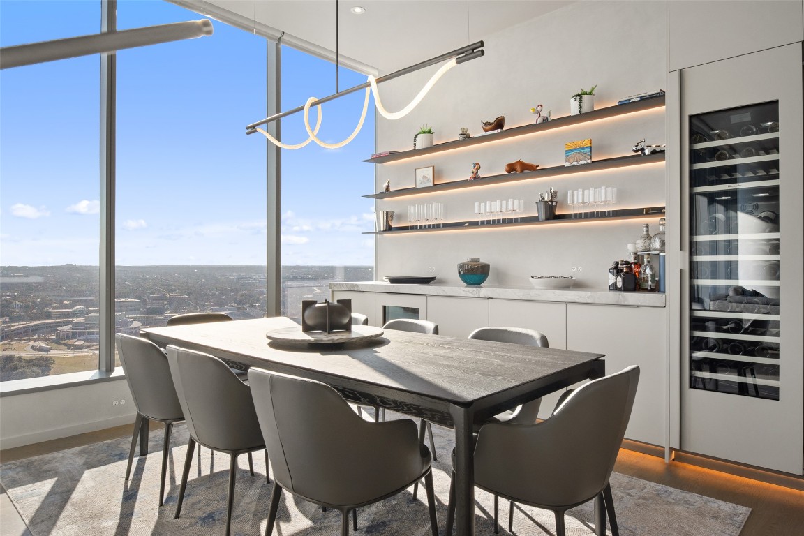 210 Lavaca Street, Unit 2301 Austin, TX 78701 - Photo 19 of 40 a table and chairs in a blue kitchen