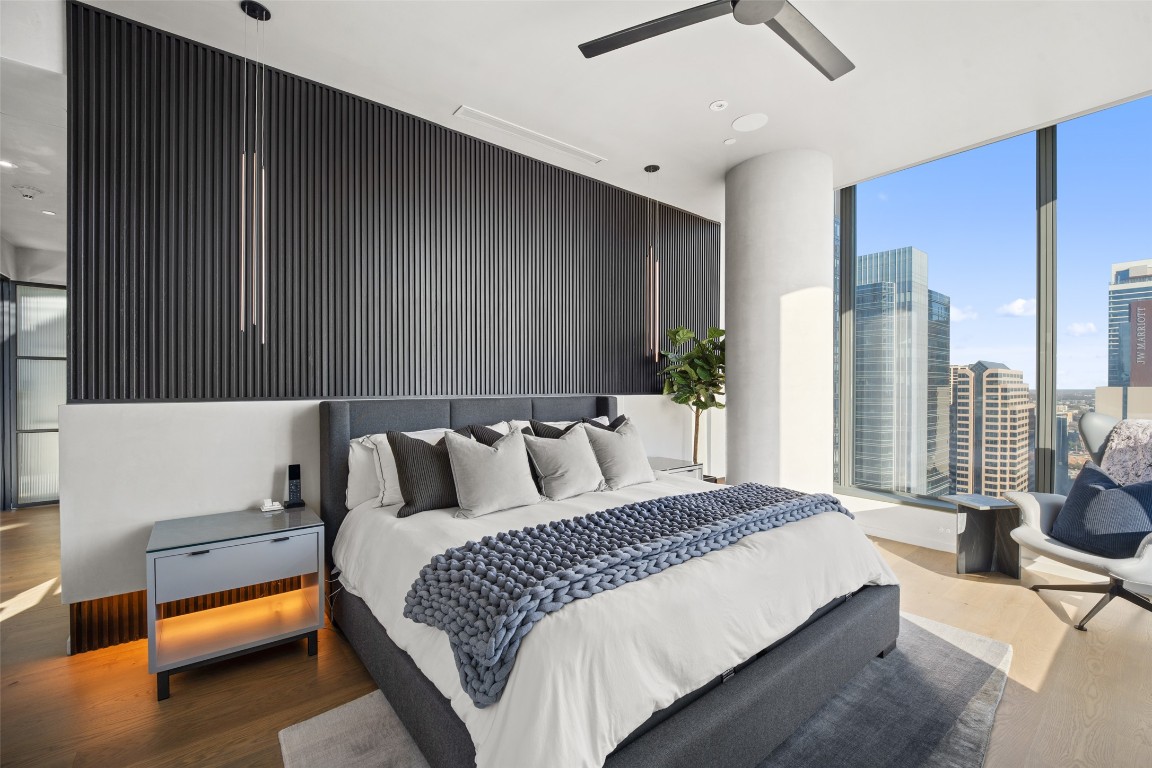 210 Lavaca Street, Unit 2301 Austin, TX 78701 - Photo 20 of 40 a bedroom with a bed and glass window