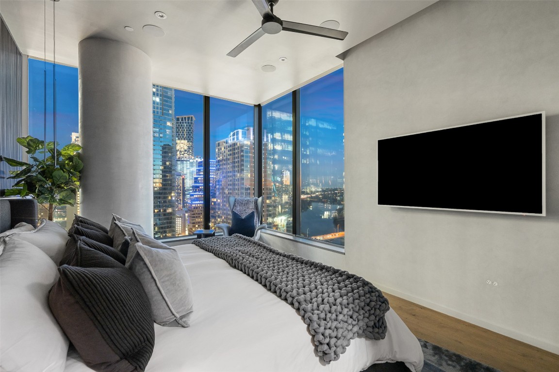 210 Lavaca Street, Unit 2301 Austin, TX 78701 - Photo 22 of 40 a spacious bedroom with a large bed and a flat screen tv