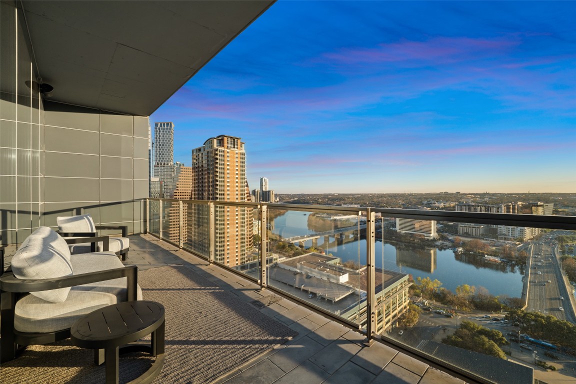 210 Lavaca Street, Unit 2301 Austin, TX 78701 - Photo 35 of 40 a view of a balcony with chair and glass door