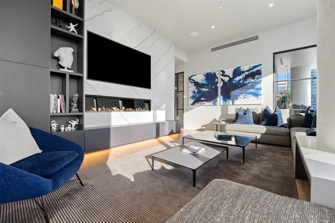 210 Lavaca Street, Unit 2301 Austin, TX 78701 - Photo 5 of 40 a living room with furniture and a flat screen tv