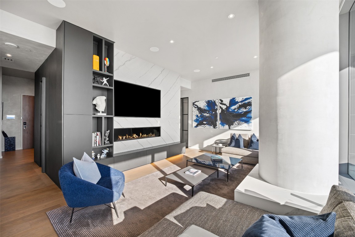 210 Lavaca Street, Unit 2301 Austin, TX 78701 - Photo 6 of 40 a living room with furniture and a flat screen tv