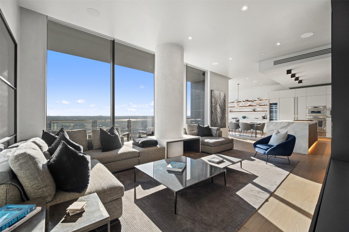 210 Lavaca Street, Unit 2301 Austin, TX 78701 - Photo 10 of 40 a living room with fireplace furniture and a large window