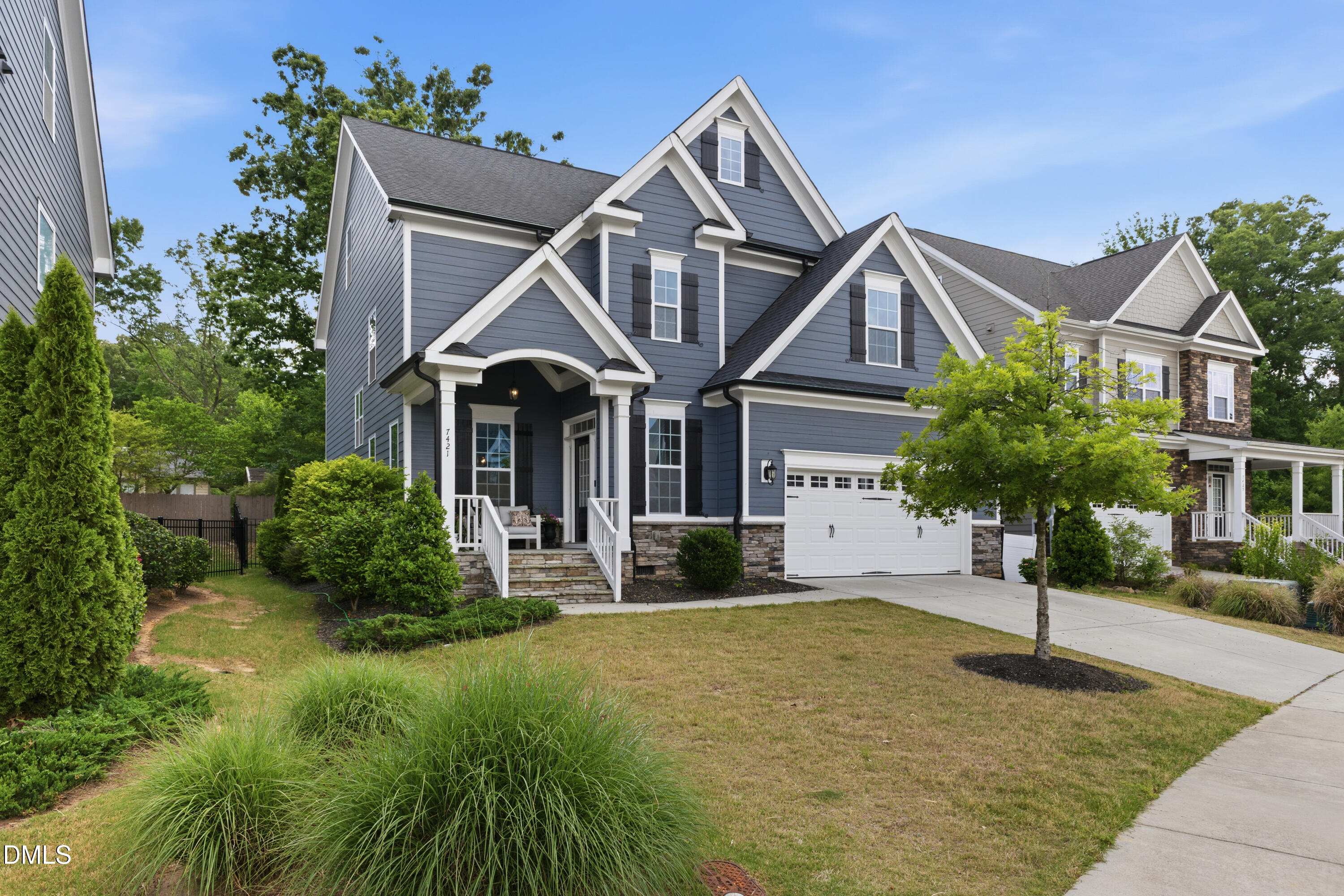 7421 Stonehenge Farm Lane Raleigh, NC 27613 - Photo 2 of 48 a front view of a house with yard and green space