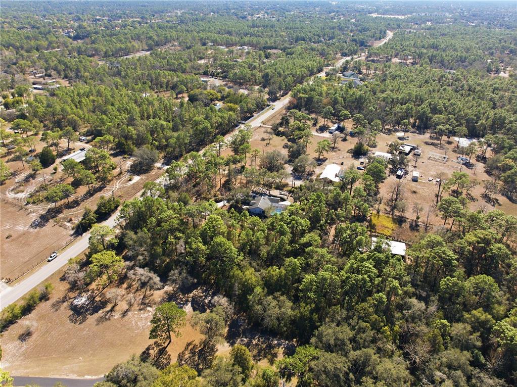 0 Barclay Avenue Spring Hill, FL 34609 - Photo 11 of 16 a view of a city with green field