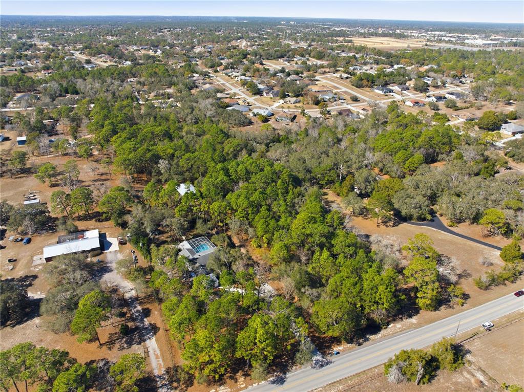 0 Barclay Avenue Spring Hill, FL 34609 - Photo 3 of 16 an aerial view of residential houses with outdoor space