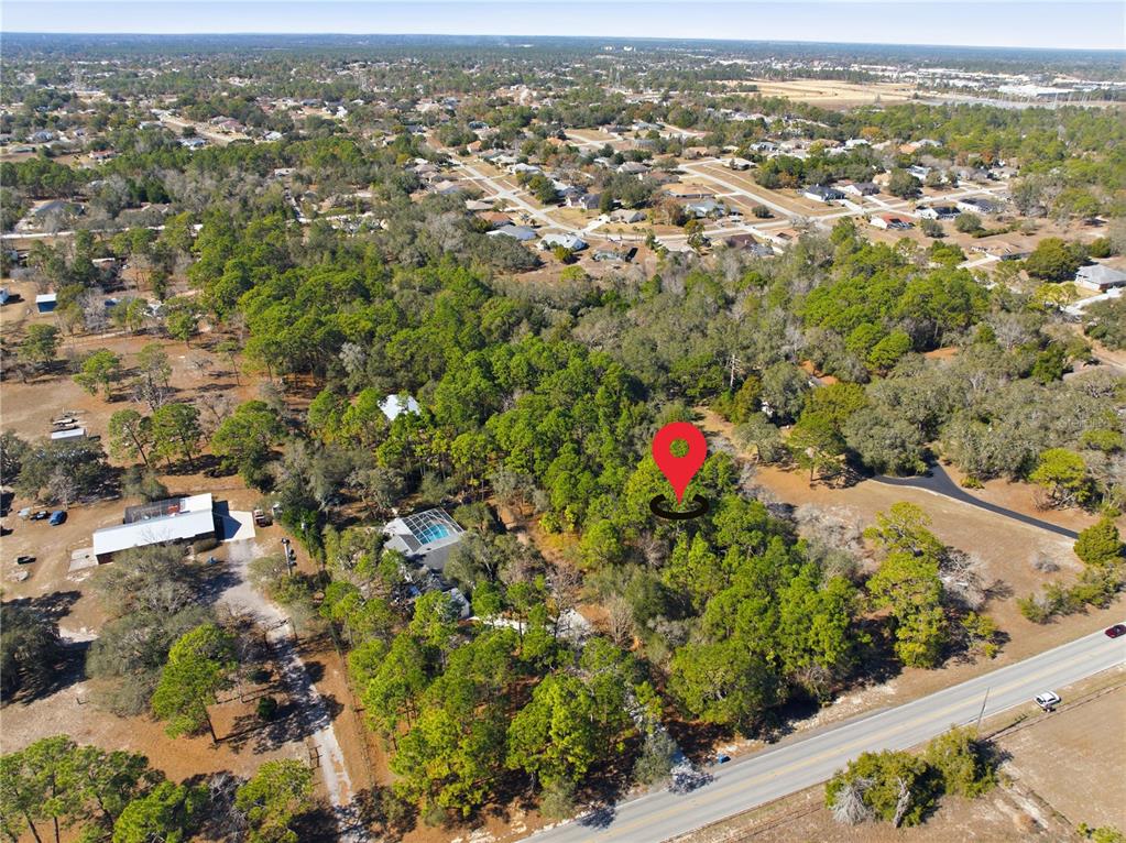 0 Barclay Avenue Spring Hill, FL 34609 - Photo 4 of 16 an aerial view of residential houses with outdoor space and trees