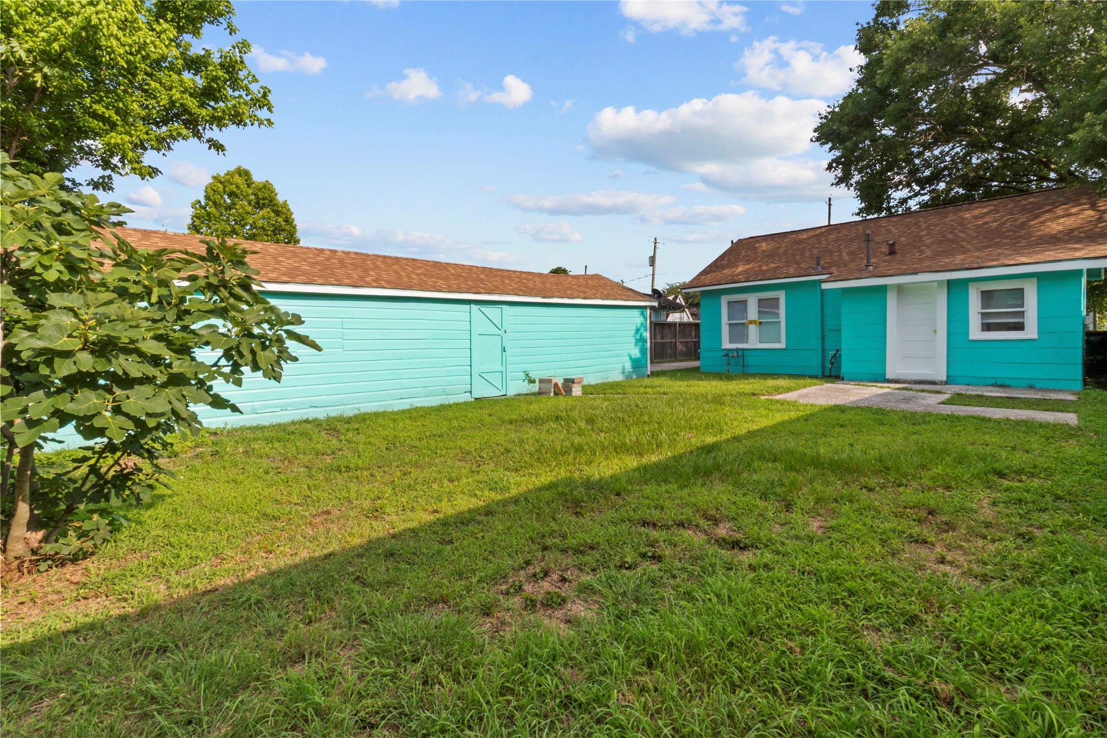 706 East Hunnicutt Street Baytown, TX 77520 - Photo 12 of 12 a view of a house with a big yard